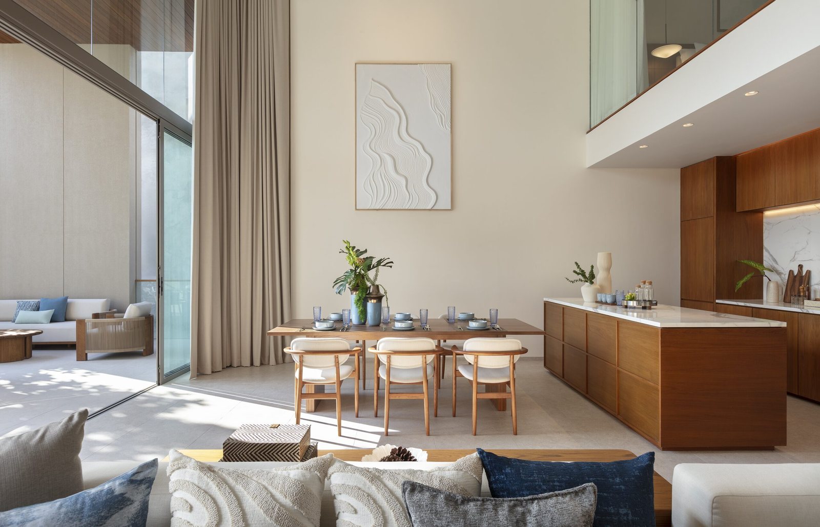 Kiara Reserve Residences — duplex residence dining area and open kitchen