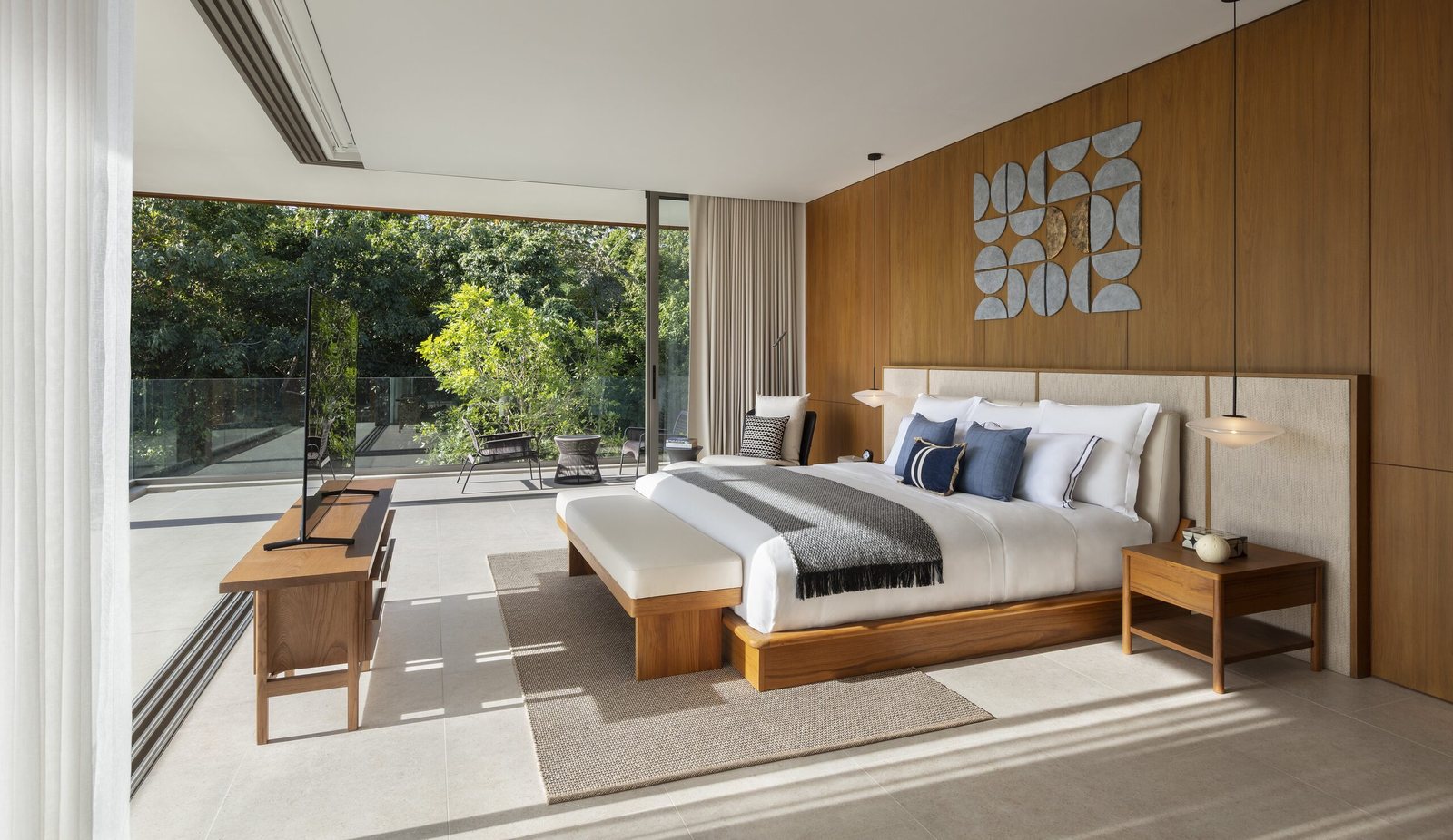 Kiara Reserve Residences — four-bedroom villa master bedroom opening to the garden