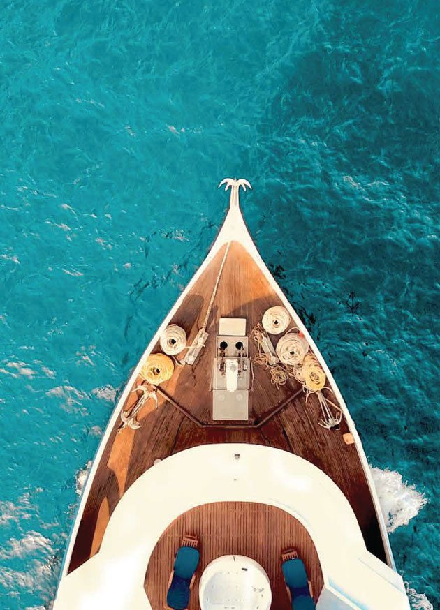 Aerial view of a boat on the Andaman Sea off Layan Bay