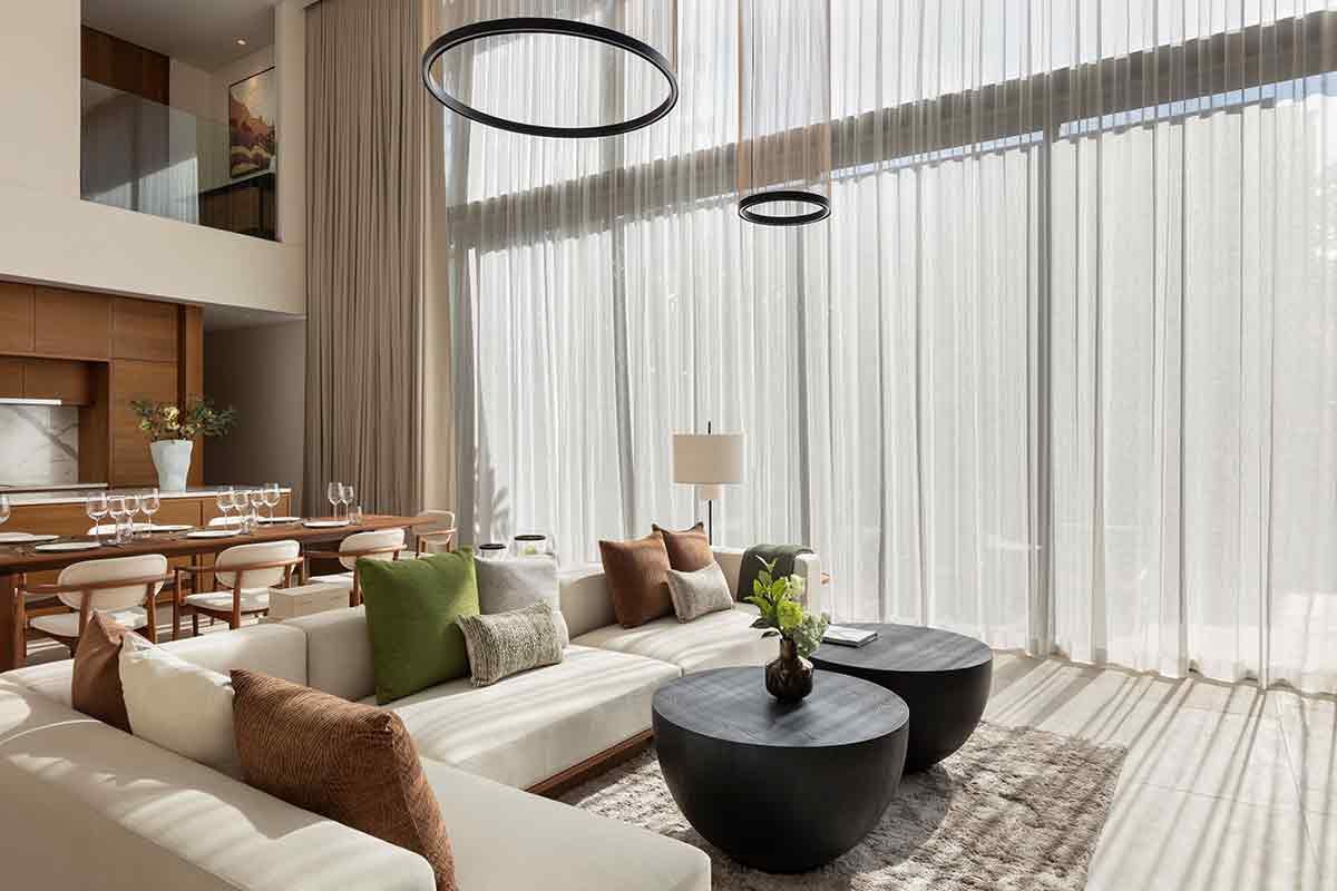 Kiara Reserve Residences — villa living room with floor-to-ceiling curtains