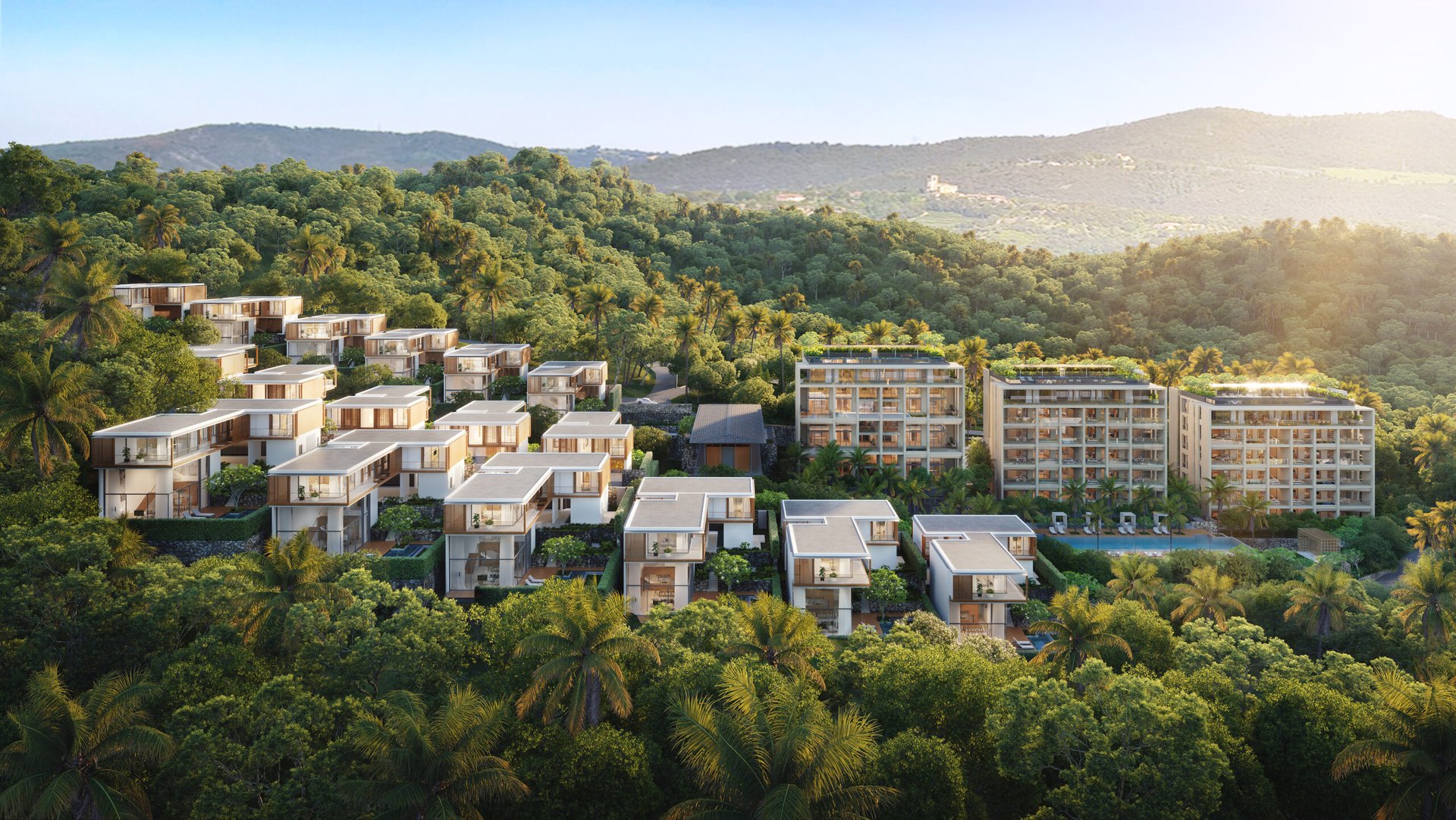 Kiara Reserve Residences — aerial view of villas and condominiums on the hillside above Layan Bay